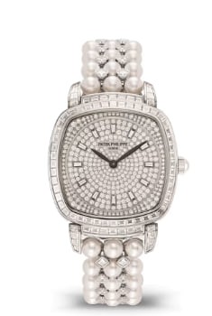 The Patek Philippe Gondola 7042/100G-010 features a diamond-set black and white gold trapezoidal hour markers, an 18K gold dial base, and black and white gold leaf-shaped hands